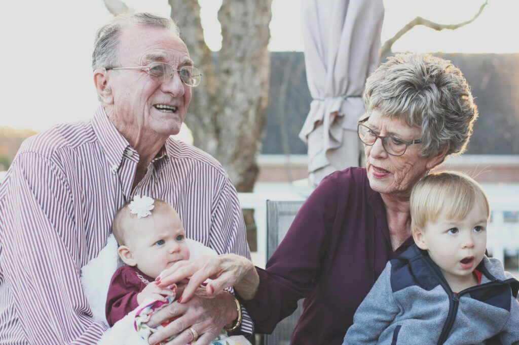 Photo of Grandpa, Grandma and two young children to showcase the love between generations